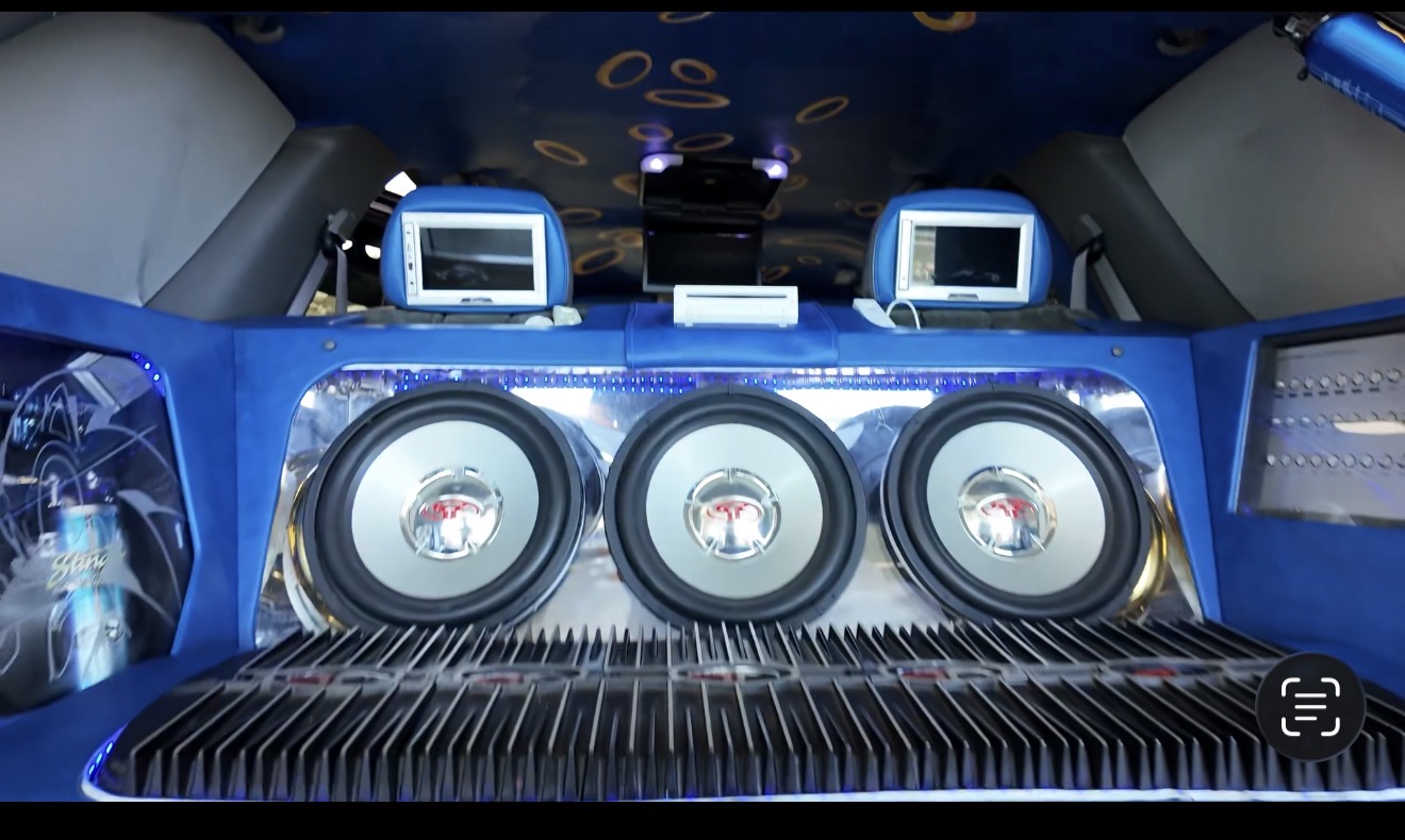 Trunk build with triple subwoofers and amp rack